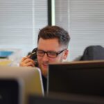 man using IP phone inside room